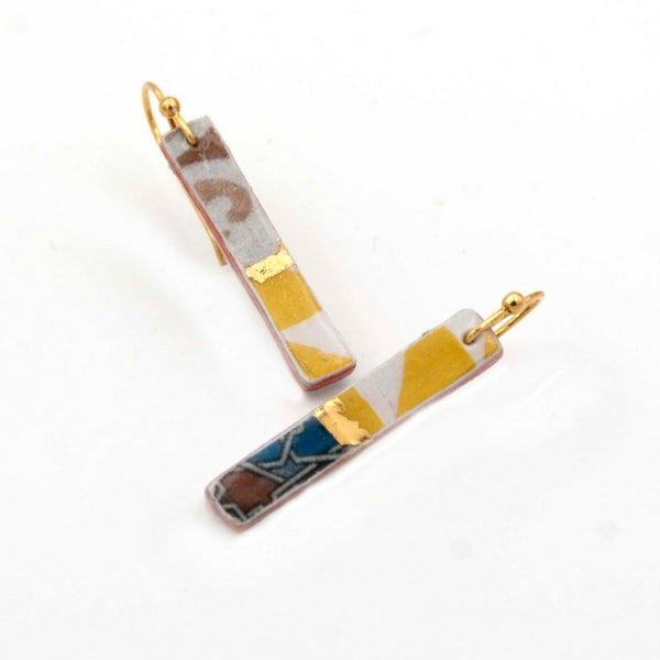 Thin earrings with rectangle shape and hand painted gold details