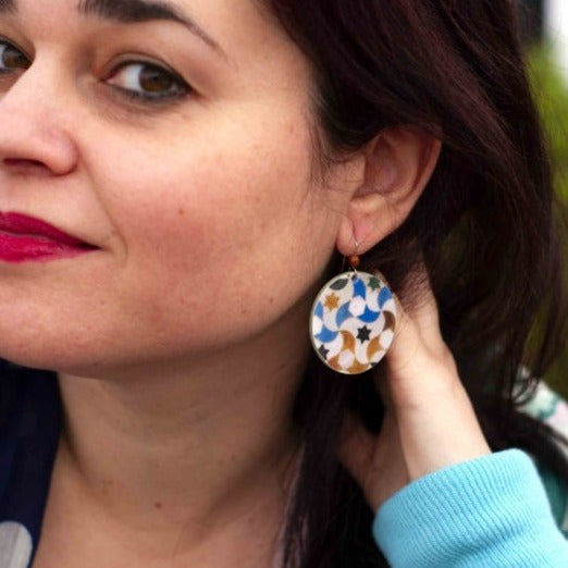 Woman with round colorful earrings inspired by islamic tiles art