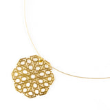 Gold pendant inspired by islamic art