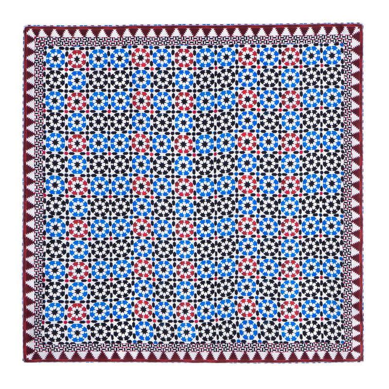 Silk square neck scarf with blue, red, white and black print inspired by islamic mosaic tiles